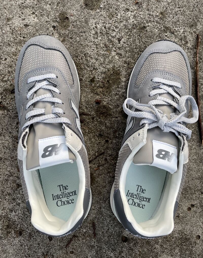A pair of running shoes on concrete